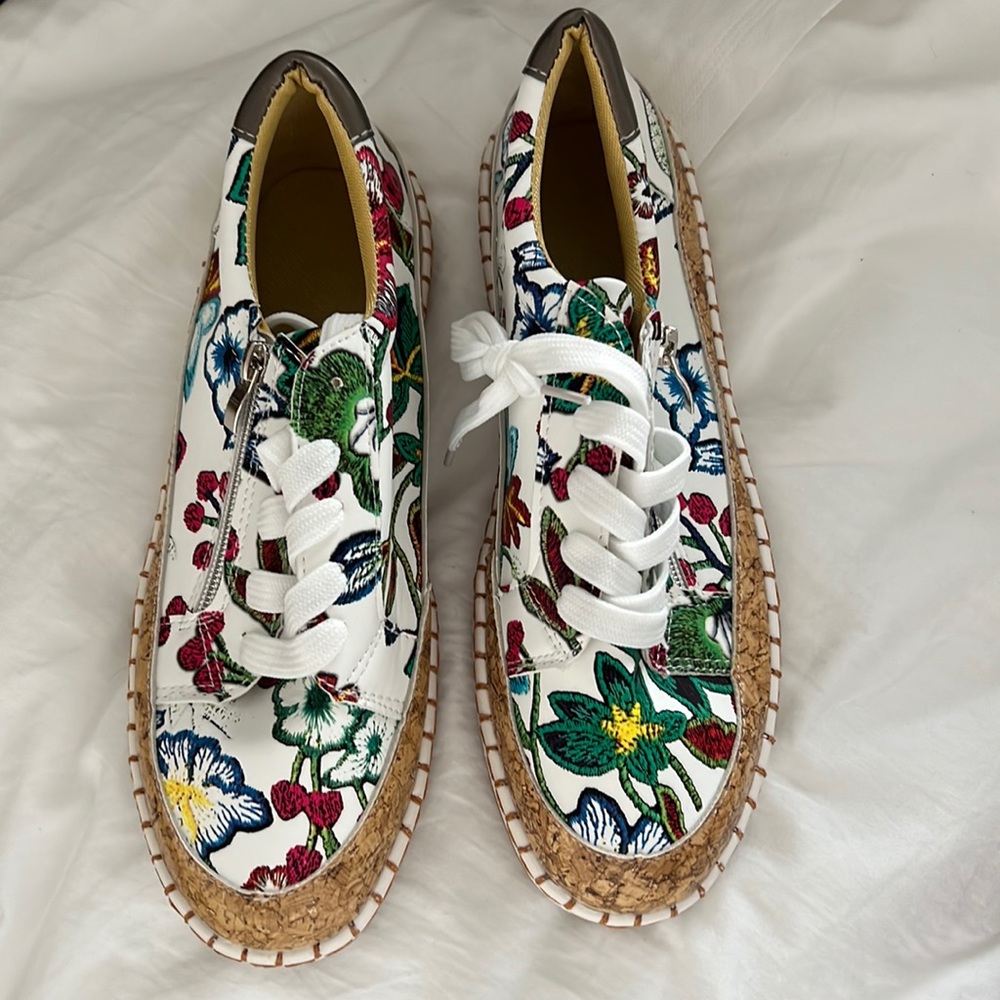 A stylish multi colored sneakers. They are brand new, never worn.